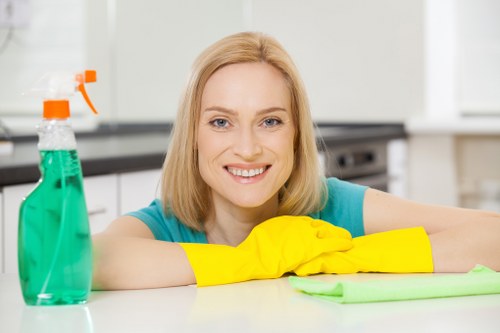 Office workspace being cleaned for hygiene and organization