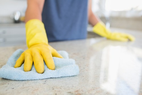 Detailed cleaning of kitchen and bathroom areas during a deep clean